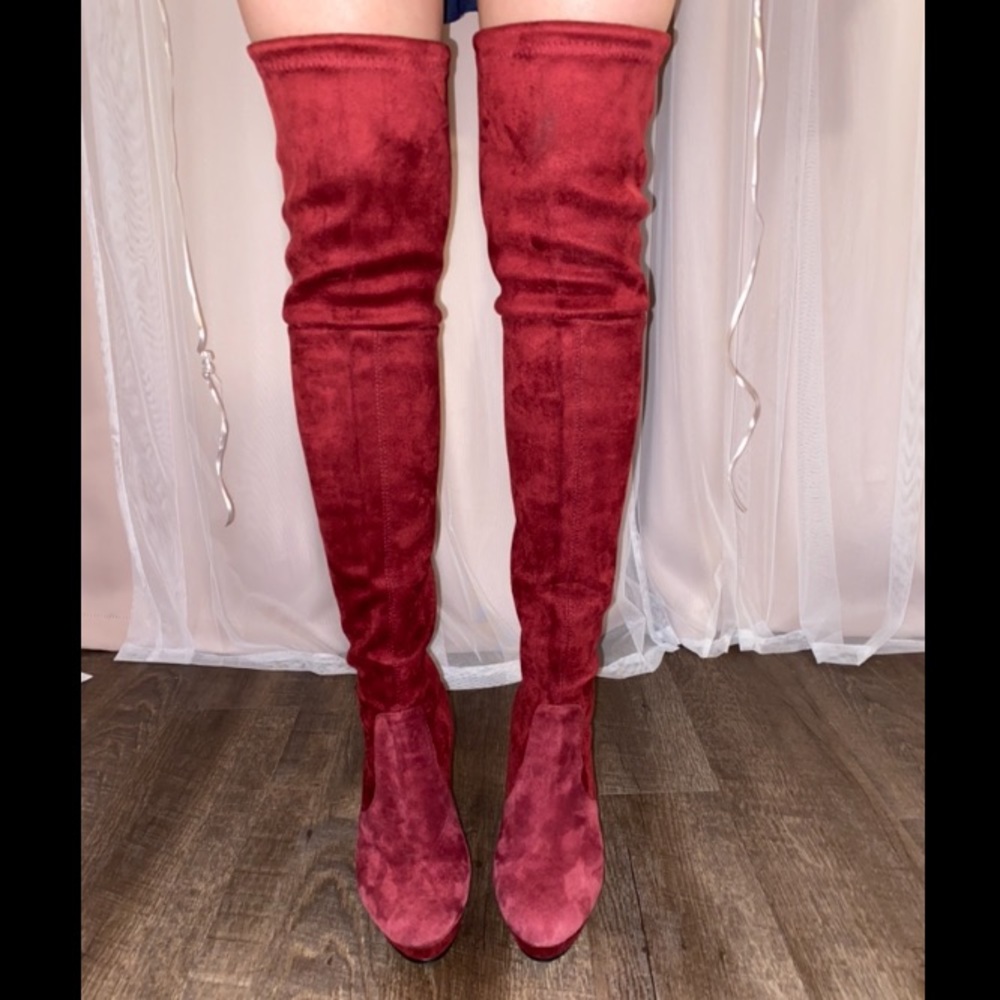 Stuart Weitzman burgundy high boots.